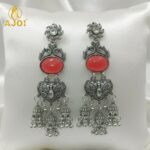 Vintage-Inspired Oxidized Silver Red Stone Jhumka Earrings with Ornate Filigree Design and Cascading Bell Danglers - Image 4