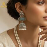 Heritage Royal Oxidized Silver Jhumka Earrings with Aqua Stone, Hand-Carved Motifs, White Crystal Embellishments & Pearl Drop Finish. - Image 2
