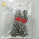 Vintage-Inspired Oxidized Silver Red Stone Jhumka Earrings with Ornate Filigree Design and Cascading Bell Danglers - Image 7