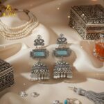 Heritage Royal Oxidized Silver Jhumka Earrings with Aqua Stone, Hand-Carved Motifs, White Crystal Embellishments & Pearl Drop Finish. - Image 4